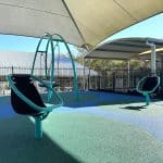 spinning chairs with sky blue frame set in rubber surfacing