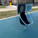 Chair Spinner with Blue frame with light blue and dark blue sensory panels behind