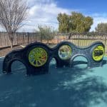 Sensory Play Centre with denim blue rotomoulded plastic walls and bright green round panel inserts
