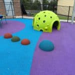 Green dome for climbing and hiding with blue, green and red half rubber domes for balancing