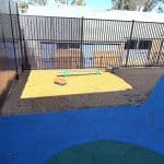bark mulch pit with balance beams and steppers with timber looking planks