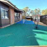 Green rubber surfacing with a stand up spinner
