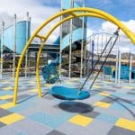 Arched yellow frame swing with blue plastic round bucket seat