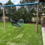 steel framed shade structure over sandpit area with charcoal coloured shade cloth canopy
